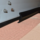 nzmegabuy black flexible rubber garage door bottom seal strip installed on a white metal door frame