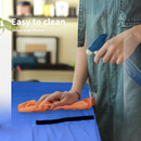 nzmegabuy heavy duty blue tarp mattress storage bag being cleaned with a cloth and spray bottle