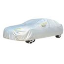 nzmegabuy 3-layer waterproof aluminum car cover with reflective strips, protecting a sedan on a grassy lawn.