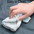 nzmegabuy green self-inflating camping mattress surface being wiped clean with a cloth