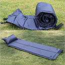 nzmegabuy blue self-inflating camping mattress with built-in pillow, shown rolled up and fully inflated on grass.