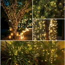 nzmegabuy 12m solar fairy lights with 100 warm white LEDs wrapped around trees and plants for outdoor garden decor