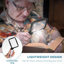 nzmegabuy Tobegiga rectangular magnifying glass with 5 dimmable LED lights being used by a senior to read a book