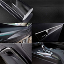 nzmegabuy 5D gloss black carbon fibre vinyl wrap applied to car interior dashboard, door trim, and gear console