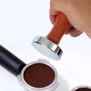 nzmegabuy stainless steel espresso coffee tamper with ergonomic wooden handle being used on a portafilter basket