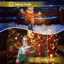 nzmegabuy solar fairy lights with 100 warm white LEDs decorating a child in snow and a woman holding a gift