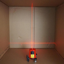 nzmegabuy 360-degree self-leveling red laser level projecting horizontal and vertical lines on a wall