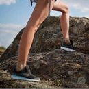 nzmegabuy nude plantar fasciitis compression socks worn by a person hiking on rocky terrain in athletic sneakers