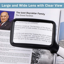 nzmegabuy Tobegiga rectangular 3X magnifying glass with LED lights held over a book for clear reading assistance