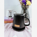 nzmegabuy black USB coffee mug warmer with lid and spoon, featuring three heat settings on a patterned tablecloth