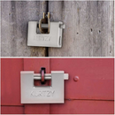 nzmegabuy hardened steel shipping container padlock with two keys secured on wooden and metal doors