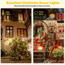 nzmegabuy 12m solar fairy lights with 100 warm white LEDs decorating a Christmas tree and outdoor house exterior