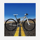 nzmegabuy black waterproof triangle frame bag mounted on a silver mountain bike against a desert road background