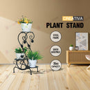 nzmegabuy 3-tier black metal plant stand with decorative scrollwork in a modern living room setting