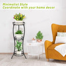 nzmegabuy 3-tier black metal foldable plant stand holding three potted plants in a modern living room setting