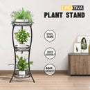 nzmegabuy 3-tier foldable black metal plant stand displaying three potted plants in a modern living room setting.