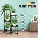 nzmegabuy 5-tier black metal foldable plant stand holding five potted plants in a modern living room setting.