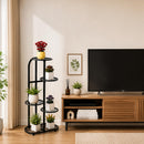 nzmegabuy 5 tier black steel plant stand holding various potted plants in a modern living room setting
