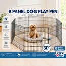 nzmegabuy 8 panel black metal dog playpen with a small dog sitting inside on a grey bed, set up indoors.