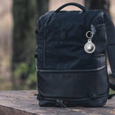 nzmegabuy waterproof TPU AirTag keychain holder attached to a black backpack for secure tracking