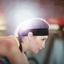 nzmegabuy black breathable sports headband worn by a woman during a gym workout to absorb sweat and keep hair back