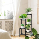 nzmegabuy 5-tier black metal foldable plant stand holding five potted plants in a bright living room corner