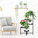 nzmegabuy 5-tier black metal foldable plant stand holding various potted plants in a modern living room setting