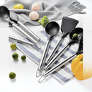 nzmegabuy 13-piece black silicone kitchen utensil set with stainless steel handles arranged on a kitchen towel