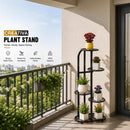 nzmegabuy 5 tier black steel plant stand on a balcony holding various potted plants and flowers