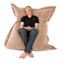 nzmegabuy LAZY BEAN brown velvet floor cushion cover, 135x105cm, featuring a young man sitting on it.