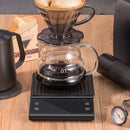 nzmegabuy digital coffee scale with timer under a glass pour-over dripper on a wooden table