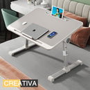 nzmegabuy grey adjustable foldable laptop bed desk with tilting tabletop and device slot on a bed