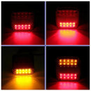 nzmegabuy 2pc 12V LED trailer tail lights showing red brake and amber turn signal illumination in dark conditions