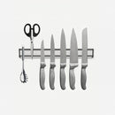 nzmegabuy wall-mounted silver magnetic knife strip holding various kitchen knives, scissors, and a metal utensil