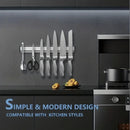 nzmegabuy silver magnetic knife strip mounted on a dark kitchen wall holding various stainless steel knives