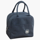 nzmegabuy navy blue insulated lunch bag with carry handles and a cute bear logo patch on a wooden kitchen table