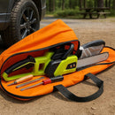 nzmegabuy orange chainsaw carry bag with a lime green chainsaw and tools inside, placed on a dirt ground outdoors.