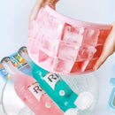 nzmegabuy pink flexible silicone ice cube tray with lid being used to release ice cubes into a drink bucket