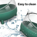 nzmegabuy tilted cat-shaped hamster food bowl in green acrylic, showing easy-to-clean surface with water splashes