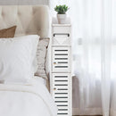 nzmegabuy white 4-layer WPC bathroom corner cabinet with slatted doors and toilet paper dispenser in a bedroom